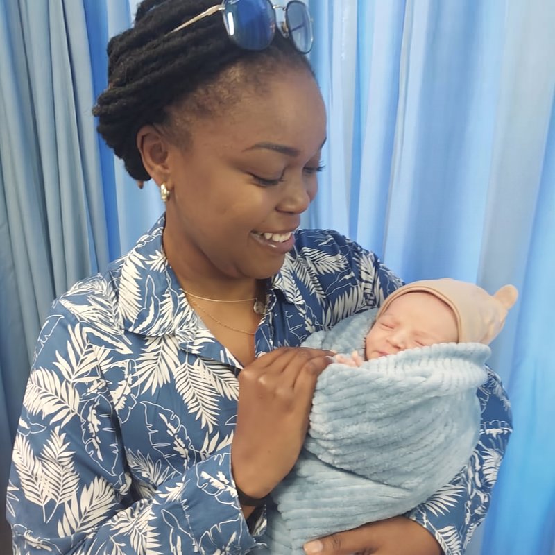 Newborn baby swaddled and settled after delivery